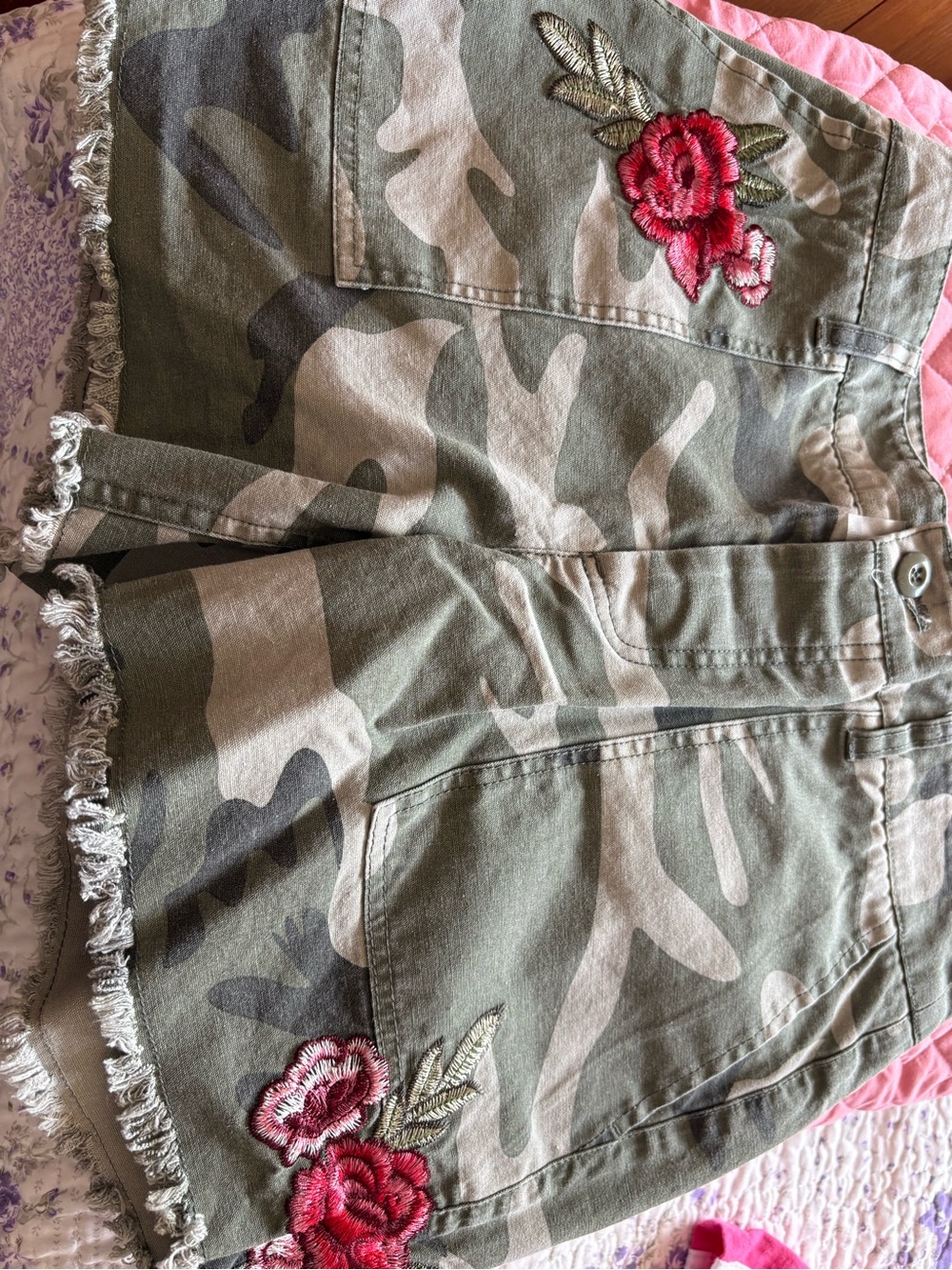 Camo shorts with embroidered rose.